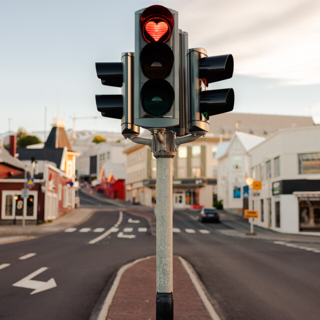 Iceland Akureyri City Love Traffic Light at Downtown City Road Intersection with a Heart Shaped Red Light. Heart Shaped Love Symbol in Red Stop Light inside a typical City Traffic Light in the City of Akureyri, Northern Iceland. Akureyri, Iceland, Northern Europe.