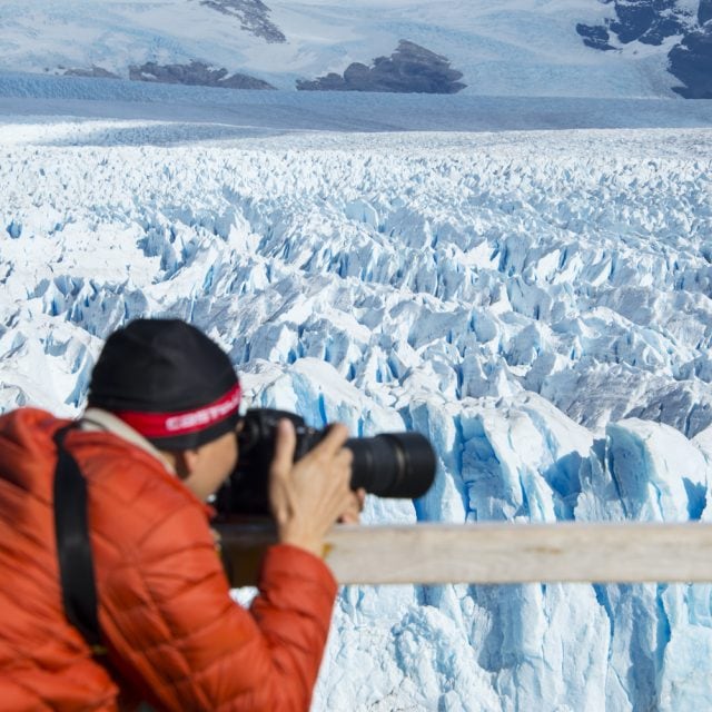 Photographer and glacier