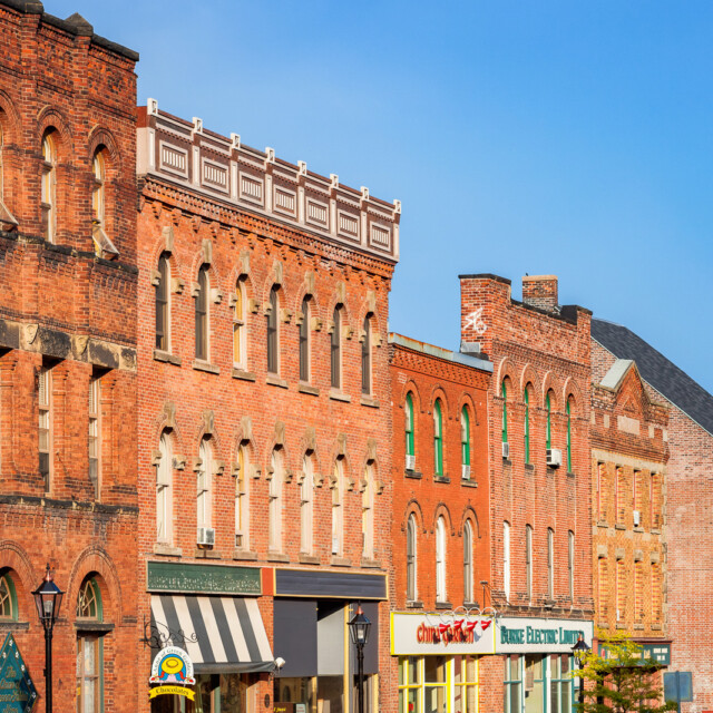 Stock photo of historic brick facades and store fronts on Queen Street, a main street in downtown Charlottetown, Prince Edward Island, Canada